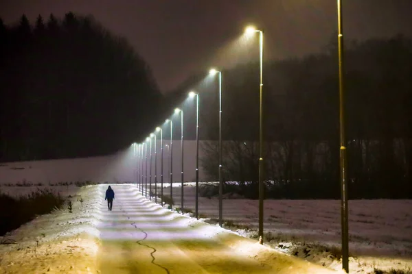 Stockholm Sweden Man Walks Snowy Illuminated Path Suburb Huddinge — Stock Photo, Image