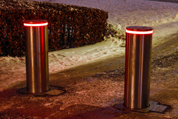 Stockholm, Sweden Safety bollards at night outside an official building.