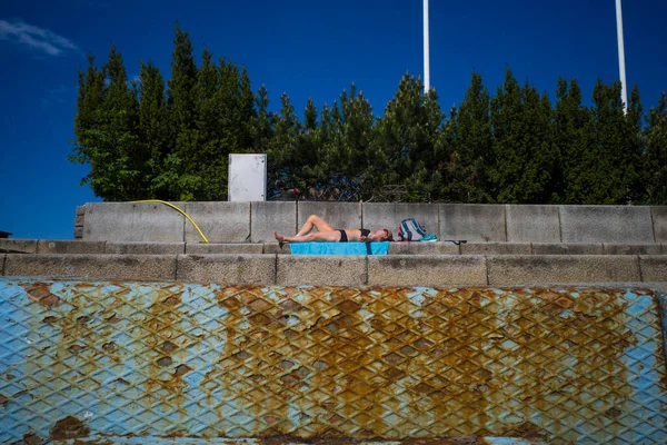 Stockholm Sweden Woman Sunbathes Alone Concrete Slab Park — Stock Photo, Image