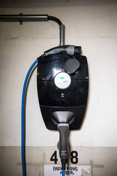 An electric charging station in a residential garage.