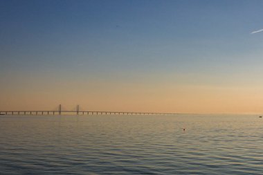 Malmo, Sweden The Oresund Bridge at sunset clipart