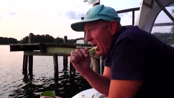 Middle Aged Man Brushes His Teeth Aft Section Small Motorboat — Stock Video