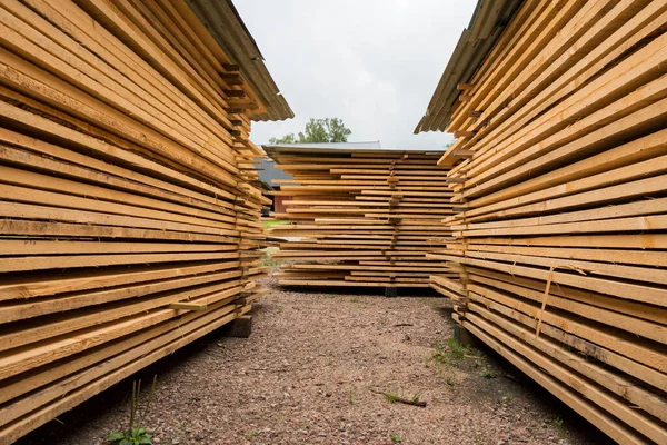 Hofsnas, Sweden Piles of fresh timber piled high waiting for a siding job.