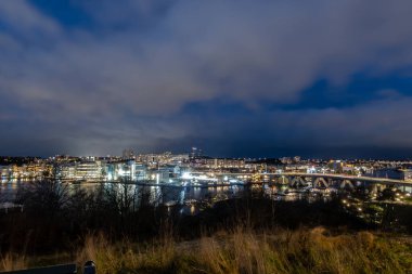 Stockholm, Sweden Dec 1, 2025 A view of the Liljeholmen Bridge at night and southern skyline.
