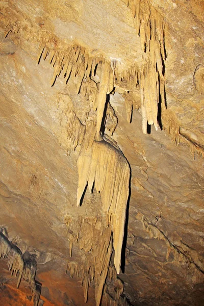 Stalactites in the water tunnel — Stock Photo, Image