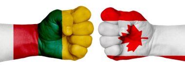 İnsanların mücadelesi kavramı. İki el birbirine kenetlenir ve birbirlerinin karşısındadır. Ülkelerin bayraklarının renklerine boyanmış eller. Kanada Litvanya 'ya Karşı