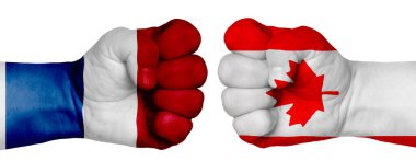 İnsanların mücadelesi kavramı. İki el birbirine kenetlenir ve birbirlerinin karşısındadır. Ülkelerin bayraklarının renklerine boyanmış eller. Kanada Hollanda 'ya Karşı