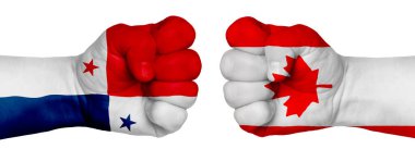 İnsanların mücadelesi kavramı. İki el birbirine kenetlenir ve birbirlerinin karşısındadır. Ülkelerin bayraklarının renklerine boyanmış eller. Kanada Panamaya Karşı