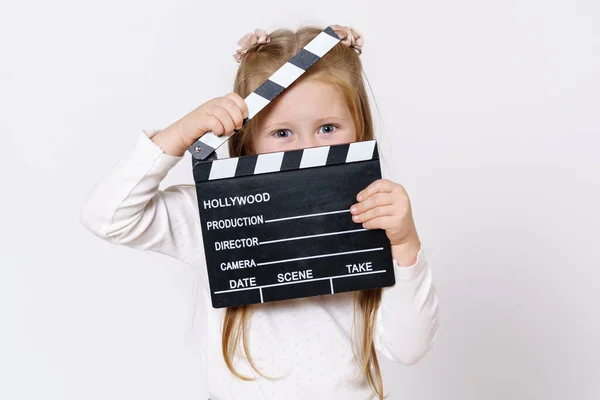 Children Concept Girl Looks Clapperboard Camera Isolated White Background — Stock Photo, Image