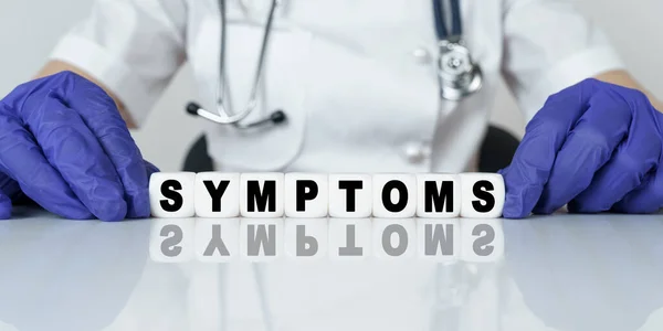 Medicine Health Concept Doctor Put Together Word Cubes Symptoms — Stock Photo, Image