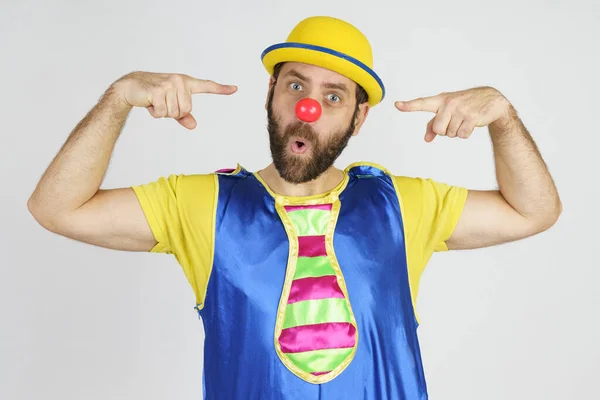 Holiday Concept Clown Bright Blue Yellow Suit Points His Fingers — Stock Photo, Image