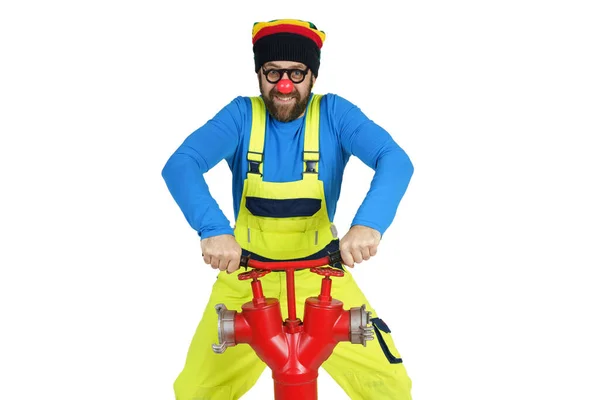 Holiday Fun Concept Clown Fireman Turns Valve Fire Hydrant — Stock Photo, Image