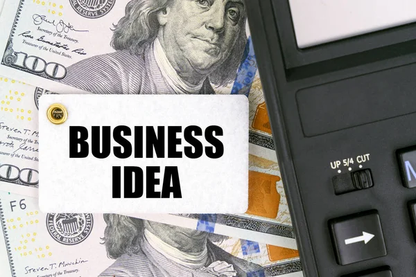 Koncepcja Biznesu Finansów Stole Dolary Kalkulator Znacznik Napisem Biznes Idea — Zdjęcie stockowe