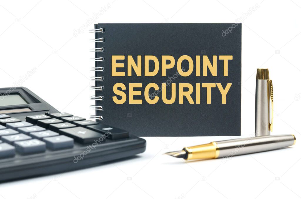 Business and finance. On a white background, there is a calculator, a pen and a black notebook with the inscription - ENDPOINT SECURITY