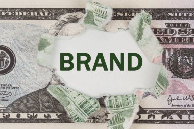 İş ve finans kavramı. Dolar ortadan ikiye bölündü. Merkezde Brand yazılıdır.