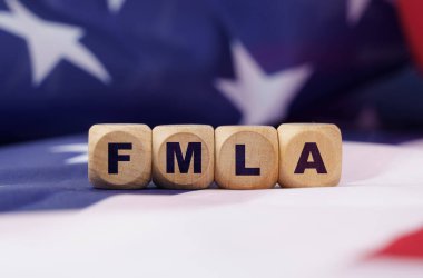 American economy and business concept. The US flag has cubes with the inscription - FMLA clipart