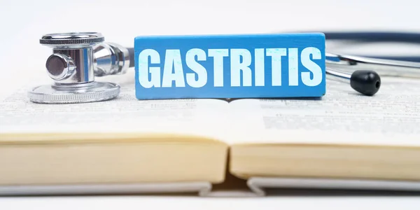 Orvosi Fogalom Könyv Egy Sztetoszkóp Egy Jenga Felirattal Gastritis — Stock Fotó