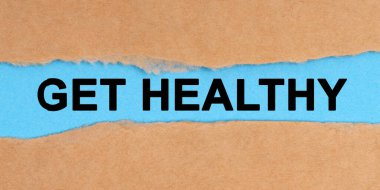 Tıp konsepti. Kağıt ortadan yırtılmış. İçinde mavi bir arkaplan var - Sağlığına kavuş