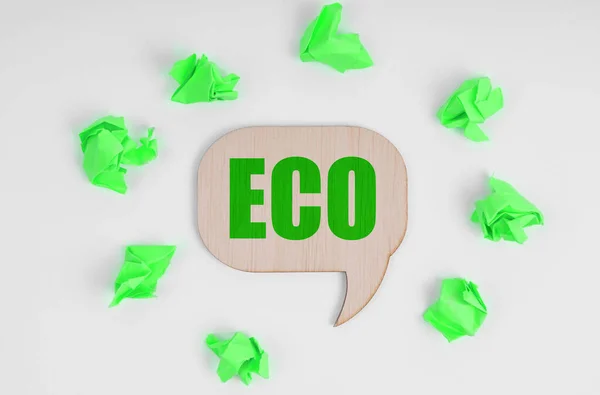 Ecology Concept White Background Crumpled Green Pieces Paper Wooden Sign — Zdjęcie stockowe