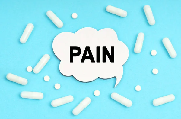 Medicine Concept Blue Background Pills Plate Sign Says Pain — Stock Photo, Image