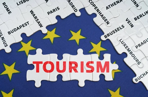 European Union concept. The EU flag has city name puzzles and puzzles with the words - tourism