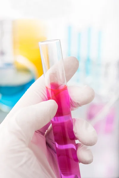 Hand holding test tube — Stock Photo, Image