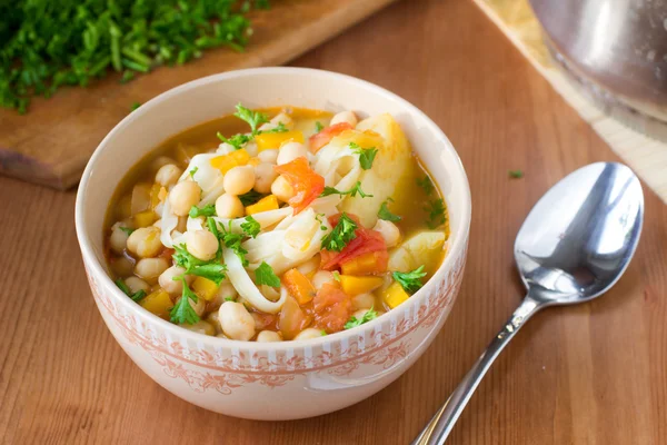 Healthy vegan soup with chickpeas, pasta, pumpkin and potato — Stock Photo, Image