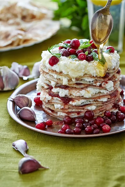 A heap of pancakes smeared with curd and jam — Stock Photo, Image