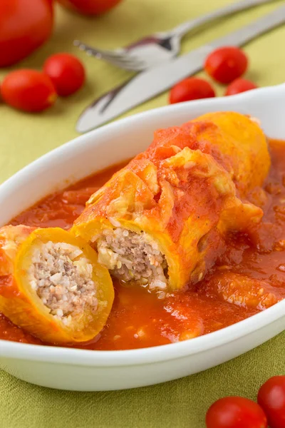 Zucchini filled with meat and rice in sauce — Stock Photo, Image