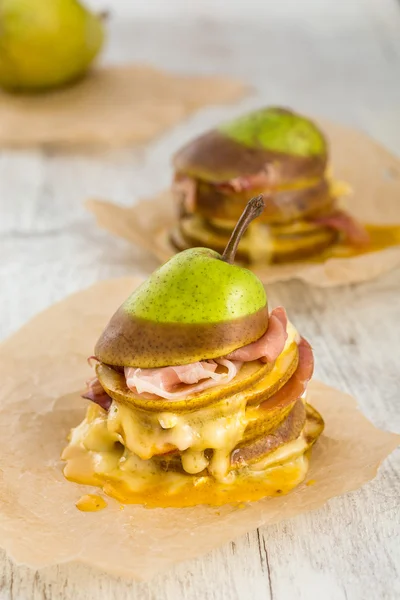Roasted pears layered with cheese and bacon — Stock Photo, Image