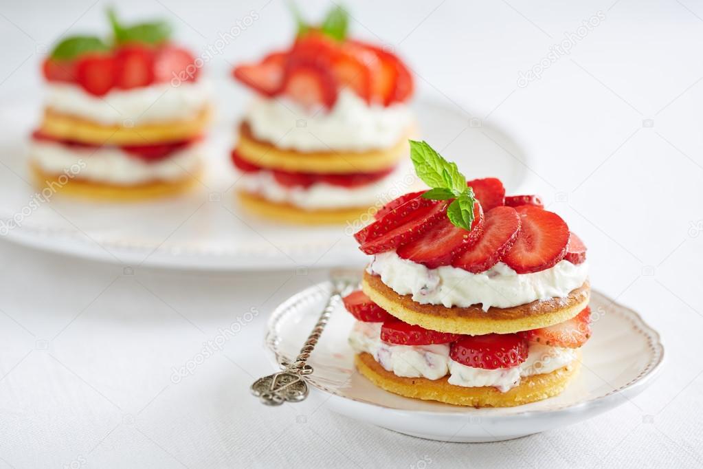 Pancakes with whipped cream and strawberries — Stock Photo © PGstudija