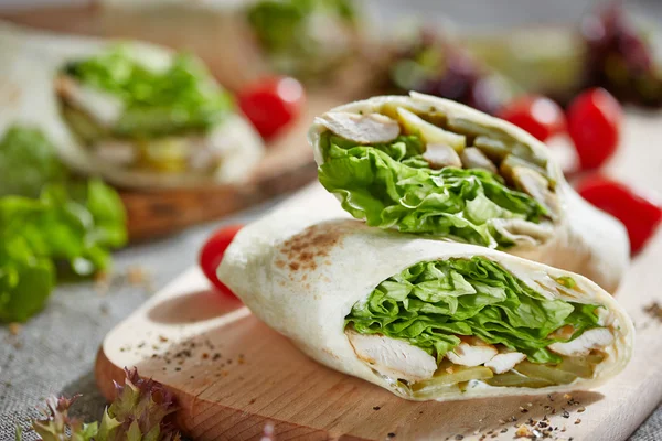 Wrap with chicken and lettuce — Stock Photo, Image