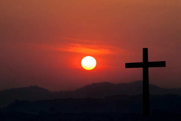 Silhouette of cross over sunset background — Stock Photo, Image
