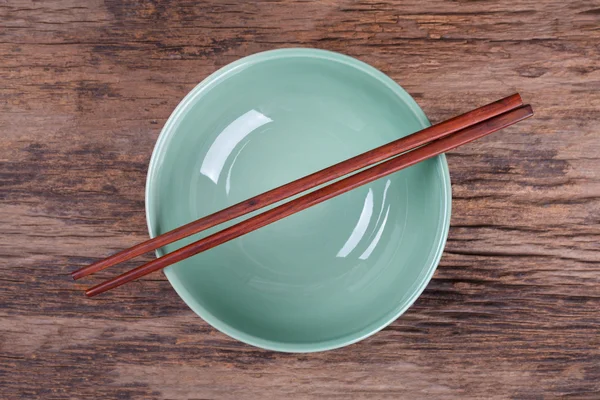 Chopsticks and black bowl — Stock Photo, Image