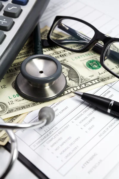 Stethoscope and dollar on blank Patient information — Stock Photo, Image