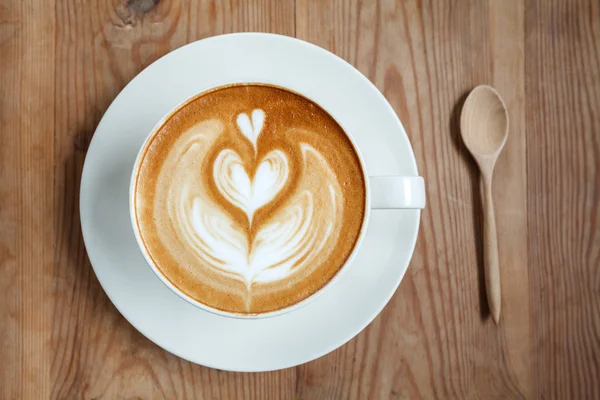 Vista superior taza de café con leche con cuchara — Foto de Stock