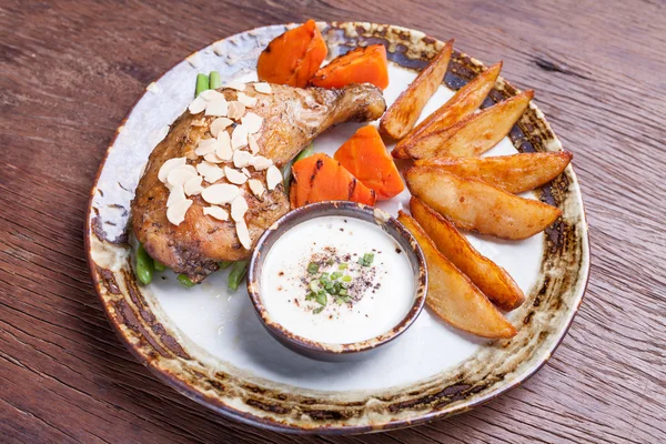 Fried chicken drumsticks with french fries,carrot on plate. — Stock Photo, Image