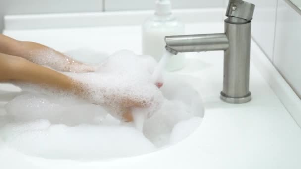 Little kid washing his hands with a liquid soap. — Stock Video