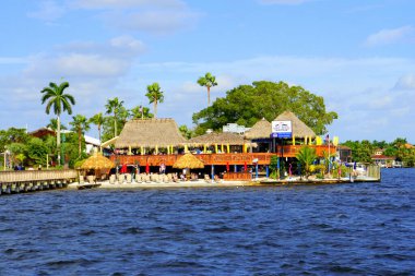 Cape Coral, Florida, U.S.A - December 3, 2018 - The view of Boat House Tiki Bar and Grill by the bay clipart