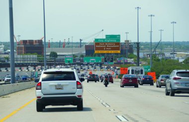 Maryland, U.S.A - May 17, 2021 - The traffic on Interstate 95 South and 895 South near EZPass toll into Baltimore Harbor Tunnel and Washington DC clipart