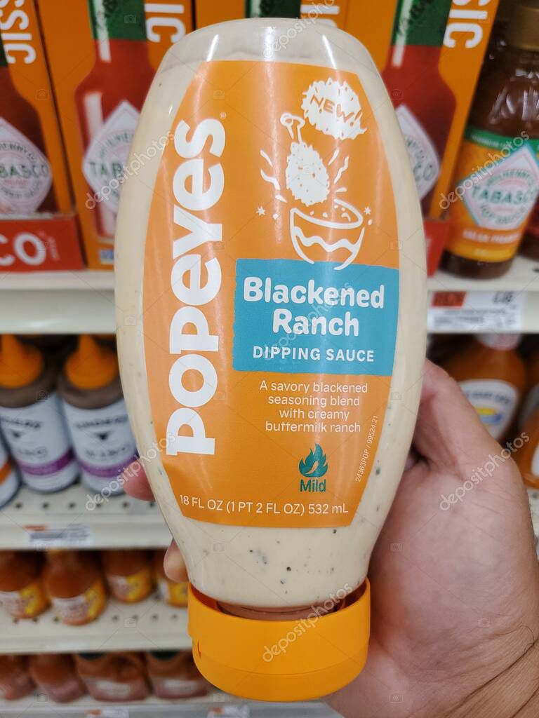 Delaware, U.S.A - Oct 29, 2025 - The 18 fl oz bottle of Popeyes Blackened Ranch Dipping Sauce, featuring the orange and blue label.