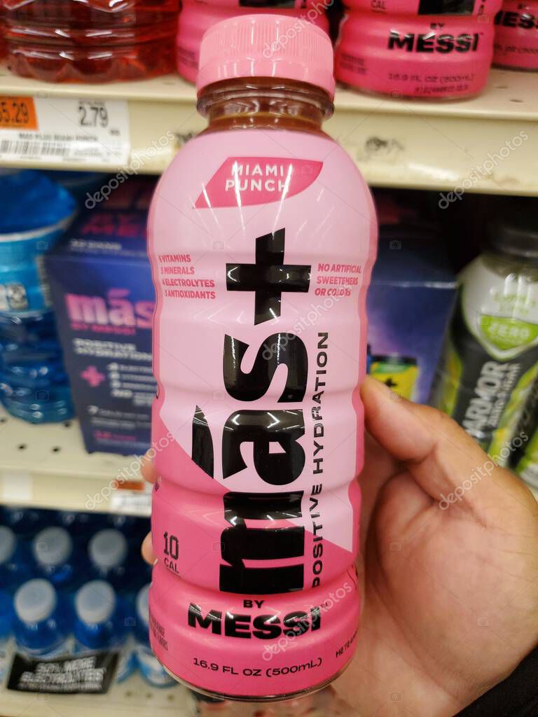 Delaware, U.S.A - Oct 29, 2025 - A pink bottle of MAS+ by Messi Miami Punch hydration drink, displaying 10 calories per 16.9 fl oz serving.