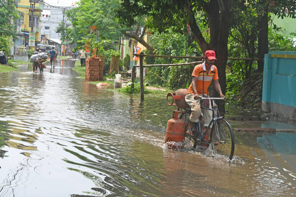 Burdwan Town, Purba Bardhaman District, West Bengal / India - 23.05.2021: A waterlogged street due to rain in Burdwan town.
