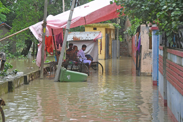 Burdwan Town, Purba Bardhaman District, West Bengal / India - 30.07.2021: In Burdwan civic town areas uncountable houses are inundated after the flood water gushed in during the last 48 hours. 