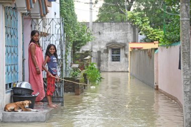 Burdwan Town, Purba Bardhaman District, West Bengal / India - 31.07.2021: Several areas of Burdwan town have been inundated by heavy rains and Banka rivulet water. clipart