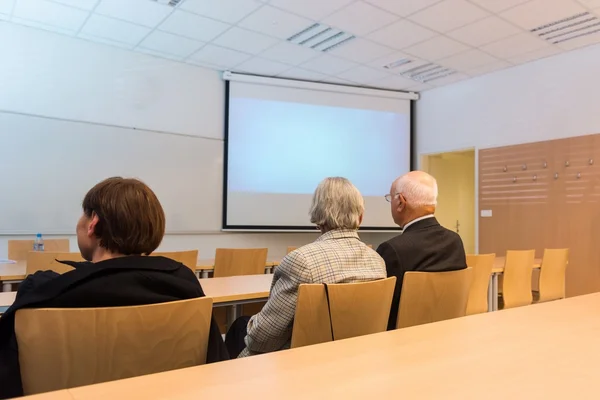 Audience at thesis presentation in a classroom. — Stock Photo, Image