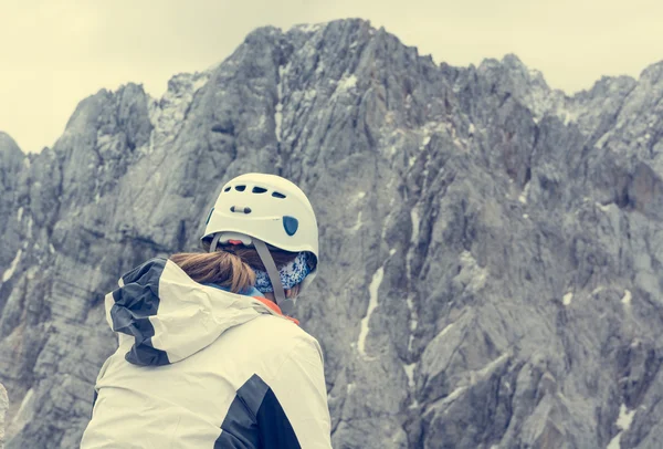 Alpinst looking at mountain wall. — Stock Photo, Image