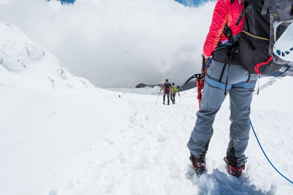 Alpinist looking down the slope.