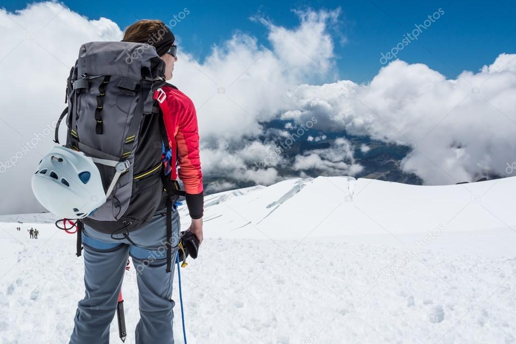 Female alpinist enjoying the view.