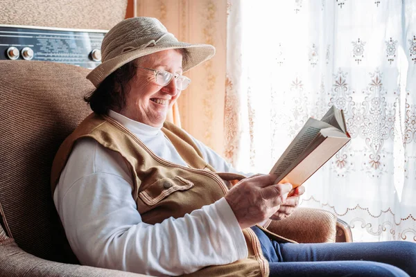 Elderly Woman Hat Reading Book Window Laughing Felling Happy Afternoon — Stock Photo, Image